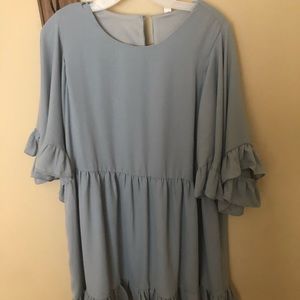 Blue dress with ruffles on the sleeves and bottom